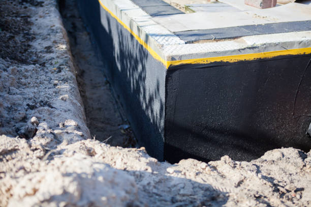 Professional Waterproofing technician working in Mcbrides, MI